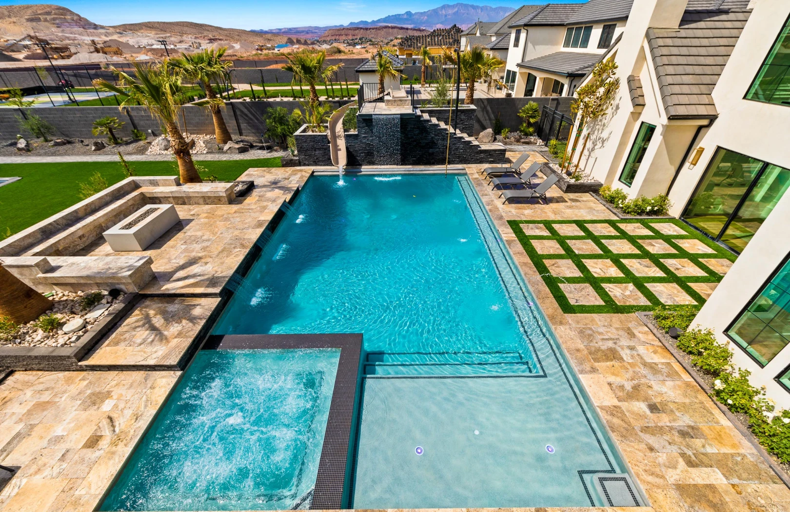 An outdoor scene showcasing the step-by-step process of artificial turf installation